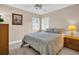 Bedroom with a double bed, nightstand, and ceiling fan at 1613 Heather Pl, Palm Harbor, FL 34684