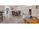 Dining area with a wooden table and chairs, overlooking the living room at 1613 Heather Pl, Palm Harbor, FL 34684