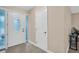 Front entry with white door, frosted glass sidelights, and tile flooring at 1613 Heather Pl, Palm Harbor, FL 34684