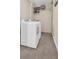 Laundry room with washer, dryer, and additional storage at 1613 Heather Pl, Palm Harbor, FL 34684