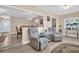 Relaxing living room featuring comfortable armchairs and a view of the dining area at 1613 Heather Pl, Palm Harbor, FL 34684