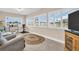 Sunroom with large windows, tile flooring, and plenty of natural light at 1613 Heather Pl, Palm Harbor, FL 34684