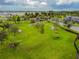 Dog park with tunnels, open space, and shaded seating at 18015 Fenders Way, Land O Lakes, FL 34638