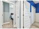 Clean hallway with doors to bedrooms and closets at 18015 Fenders Way, Land O Lakes, FL 34638