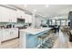 Modern kitchen with white cabinets, quartz counters, and island at 18015 Fenders Way, Land O Lakes, FL 34638