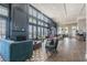 Relaxing lounge area with comfortable seating and fireplace at 18015 Fenders Way, Land O Lakes, FL 34638