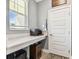 Small home office with built-in workspace and window at 18015 Fenders Way, Land O Lakes, FL 34638
