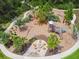 Nature-inspired playground with a fire pit and walking paths at 18015 Fenders Way, Land O Lakes, FL 34638