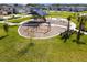Community playground with swings, shade structures, and play equipment at 18015 Fenders Way, Land O Lakes, FL 34638