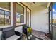 Cozy screened porch with seating area and brick flooring at 18015 Fenders Way, Land O Lakes, FL 34638