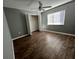 Bedroom with wood-look floors and a walk-in closet at 18116 Portside St, Tampa, FL 33647