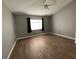 Bedroom with wood-look floors and ceiling fan at 18116 Portside St, Tampa, FL 33647