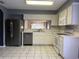 Kitchen with stainless steel appliances and white cabinets at 18116 Portside St, Tampa, FL 33647