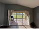View from living room to screened patio and backyard at 18116 Portside St, Tampa, FL 33647