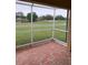 Screened porch overlooking a green golf course view at 18116 Portside St, Tampa, FL 33647