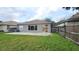 Private backyard with patio and view of house exterior at 19130 Wood Sage Dr, Tampa, FL 33647