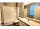 Clean bathroom with a shower/tub combo and updated vanity at 19130 Wood Sage Dr, Tampa, FL 33647