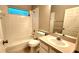 Clean bathroom with a tub, toilet and vanity at 19130 Wood Sage Dr, Tampa, FL 33647