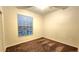 Spacious bedroom with brown carpet and window blinds at 19130 Wood Sage Dr, Tampa, FL 33647