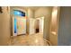 Bright entryway with tile floors and neutral colors at 19130 Wood Sage Dr, Tampa, FL 33647