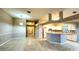 Kitchen with light cabinets, an island, and tile flooring at 19130 Wood Sage Dr, Tampa, FL 33647