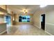 Open living room with tile floors and large window at 19130 Wood Sage Dr, Tampa, FL 33647