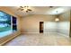 Open living room with tile floors and large window at 19130 Wood Sage Dr, Tampa, FL 33647