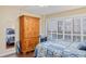 Bedroom with wood armoire and view at 2413 Bayshore Blvd # 404, Tampa, FL 33629