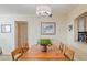 Simple dining room with wood table and chairs, adjacent to kitchen at 2413 Bayshore Blvd # 404, Tampa, FL 33629