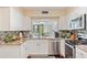 Bright kitchen with granite countertops and stainless steel appliances at 2413 Bayshore Blvd # 404, Tampa, FL 33629