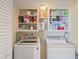 Laundry room with washer, dryer, and ample storage at 2413 Bayshore Blvd # 404, Tampa, FL 33629