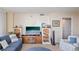 Living room with ample seating, large TV, and built-in shelving at 2413 Bayshore Blvd # 404, Tampa, FL 33629