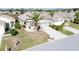 Single-Gathering home with driveway and palm tree in a residential area at 2749 Plantain Dr, Holiday, FL 34691