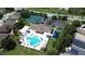 Community pool and tennis courts are seen in this aerial view at 2749 Plantain Dr, Holiday, FL 34691