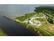 Anclote Gulf Park's aerial view shows a pier, parking lot, and lush landscape at 2749 Plantain Dr, Holiday, FL 34691