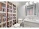 Clean bathroom with shower/tub combo, white vanity, and decorative shower curtain at 2749 Plantain Dr, Holiday, FL 34691