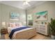 Calm bedroom with wicker bed frame, neutral color palette and stylish dresser at 2749 Plantain Dr, Holiday, FL 34691