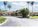 Community clubhouse; inviting entrance and landscaping at 2749 Plantain Dr, Holiday, FL 34691