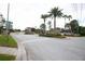 Gated community entrance with palm trees and signage at 2749 Plantain Dr, Holiday, FL 34691