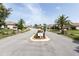 Gated community entrance with landscaping and signage at 2749 Plantain Dr, Holiday, FL 34691