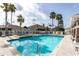 Inviting community pool with a spa and comfortable lounge chairs at 2749 Plantain Dr, Holiday, FL 34691
