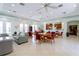 Community room with tables, chairs, and a kitchenette at 2749 Plantain Dr, Holiday, FL 34691