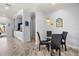 Small dining area with glass table and four chairs, perfect for casual meals at 2749 Plantain Dr, Holiday, FL 34691