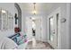 Bright and airy entryway with tile flooring and decorative accents at 2749 Plantain Dr, Holiday, FL 34691