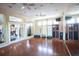 Exercise room with hardwood floors and mirrors at 2749 Plantain Dr, Holiday, FL 34691