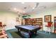 Game room with a pool table and a large bookshelf at 2749 Plantain Dr, Holiday, FL 34691