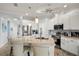 Modern kitchen with large island, stainless steel appliances, and ample counter space at 2749 Plantain Dr, Holiday, FL 34691