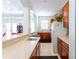 Well-equipped kitchenette with wood cabinets and appliances at 2749 Plantain Dr, Holiday, FL 34691