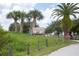 Anclote Gulf Park entrance sign is nestled amongst palm trees and lush landscaping at 2749 Plantain Dr, Holiday, FL 34691