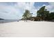 Beach with picnic pavilion and calm waters at 2749 Plantain Dr, Holiday, FL 34691